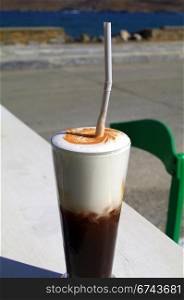 Ice cold coffee with a sea view