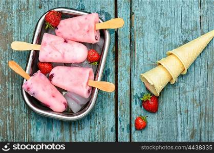 Ice cream and strawberry. Ice-cream and summer berries in metal tray with ice