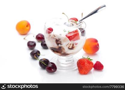 ice cream, cherries, apricots, raspberries, strawberries and spoon isolated on white