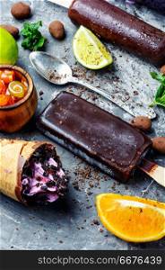 Ice cream covered with chocolate.assortment of colorful tasty popsicles.Set of ice cream. Homemade ice cream or popsicles