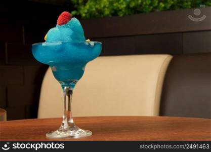 ice cream cup of blue raspberry on the table. cup of ice cream on the table