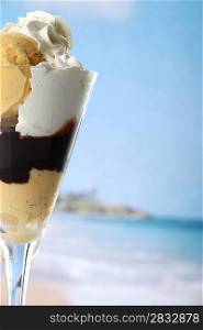Ice cream in a glass with a beach backdrop