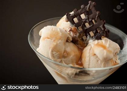 Ice cream in a vase on a dark background. Ice cream in a vase