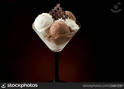 Ice cream in a vase on a dark background. Ice cream in a vase