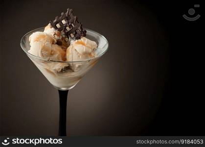 Ice cream in a vase on a dark background. Ice cream in a vase