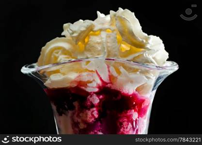 Ice cream in the glass on a black background