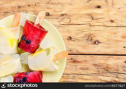 Ice cream of different colors and flavours with berries and fruits. Variety of ice cream