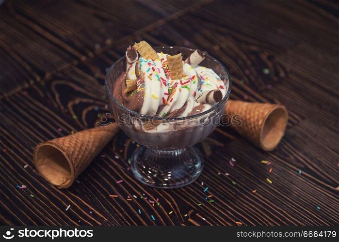 Ice-cream on brown wooden background. Ice-cream on wooden