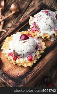 ice cream on waffles. Ice cream on baked wafers with cherries