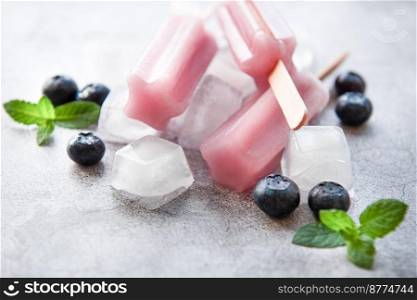 Ice cream popsicles from fresh organic blueberries. Summer sweets and desserts. Vegan food.