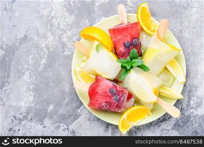 Ice cream popsicles. Summer ice cream with a taste of wild berries and lemon