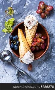 Ice cream with a taste of grapes. Summer grape ice cream in a waffle cup cone