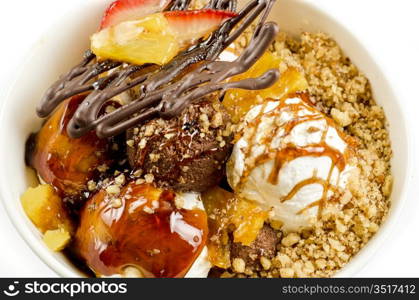 ice cream with chocolate, nuts and caramel close up