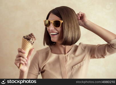 Ice cream woman singing in cone like in microphone happy, joyful and cheerful. Cute young female model eating ice cream cone