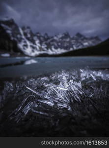 Ice crystals along the shore of Moraine Lake on a moody morning in early June.