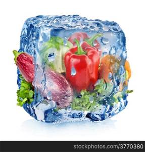 Ice cube with vegetables isolated on white
