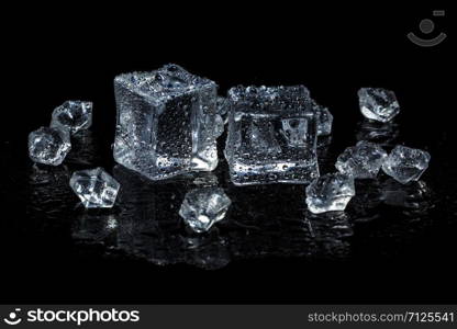 ice cubes on black isolated glass background