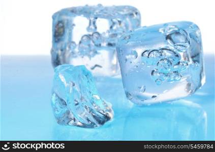 ice cubes on blue glass