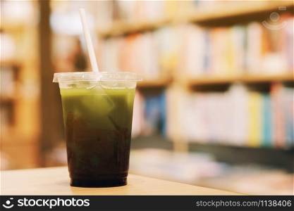 Ice green tea on recycle plastic cup and paper straw
