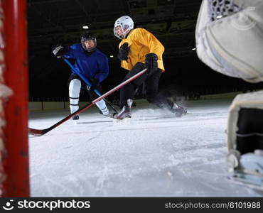 ice hockey goalkeeper player on goal in action