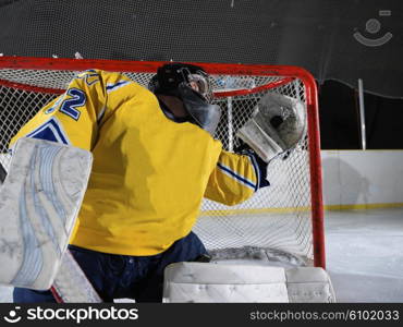 ice hockey goalkeeper player on goal in action