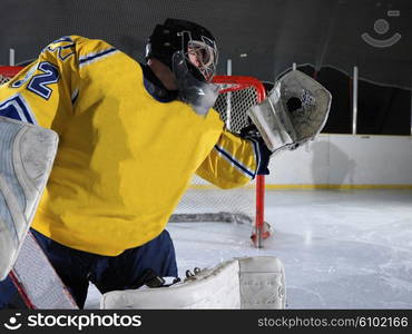 ice hockey goalkeeper player on goal in action