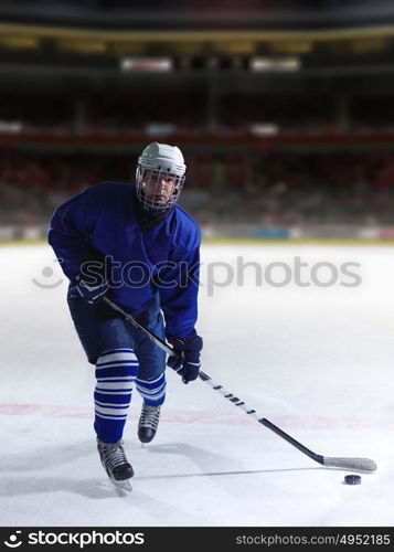 ice hockey player in action kicking with stick