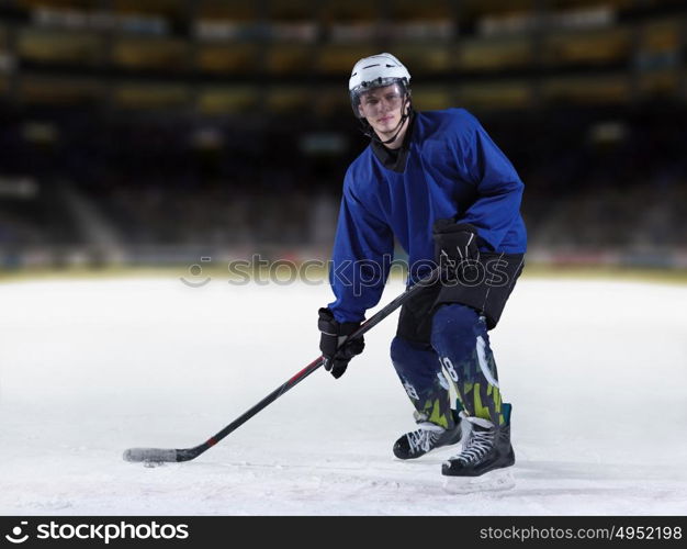 ice hockey player in action kicking with stick