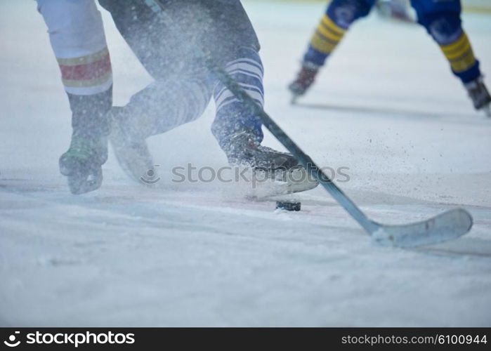 ice hockey player in action kicking with stick