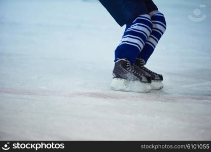 ice hockey player in action kicking with stick