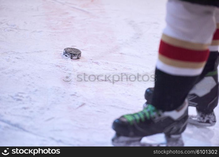 ice hockey player in action kicking with stick