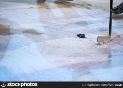 ice hockey player in action kicking with stick