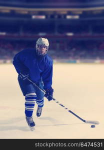 ice hockey player in action kicking with stick. ice hockey player in action