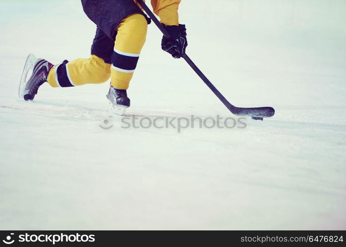 ice hockey player in action kicking with stick. ice hockey player in action