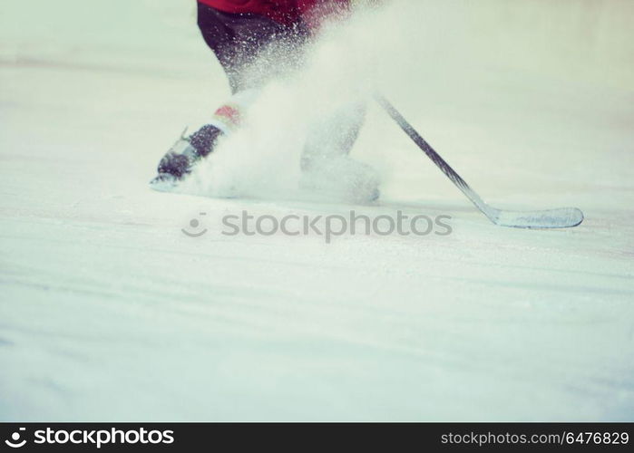 ice hockey player in action kicking with stick. ice hockey player in action