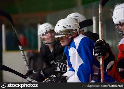 ice hockey players, group of people, team friends waiting and relaxing on bench to start game