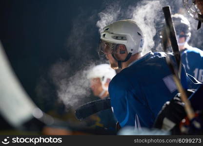 ice hockey players, group of people, team friends waiting and relaxing on bench to start game