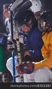 ice hockey players, group of people, team friends waiting and relaxing on bench to start game