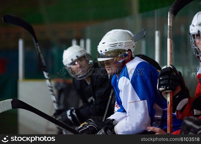 ice hockey players, group of people, team friends waiting and relaxing on bench to start game
