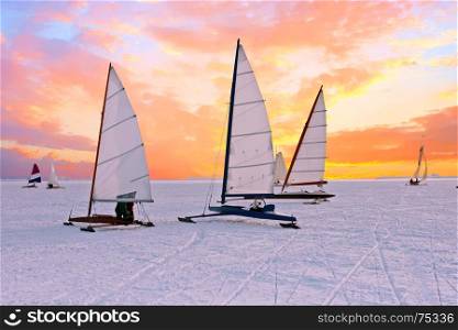 Ice sailing on the Gouwzee in the countryside from the Netherlands at sunset