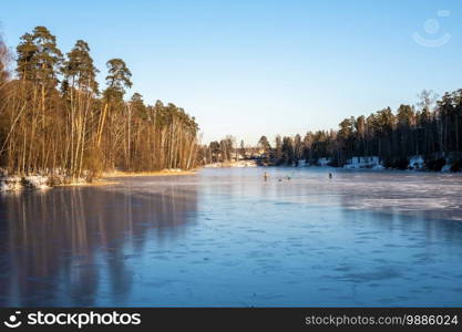 Ice skating on the first ice on the Talka river in Ivanovo, Russia.