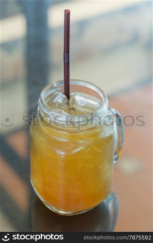 ice tea. ice tea with drinking straw on the table