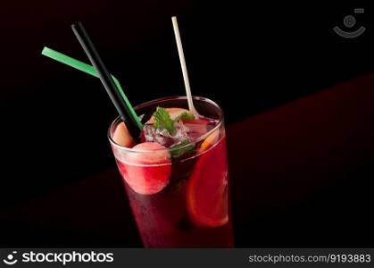 ice tea in a glass on a dark background. cold tea