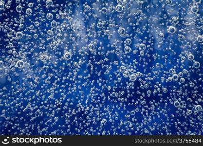 Ice texture with bubbles for background. Natural blue ice pattern