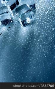 Ice with water droplets over abstract wet background