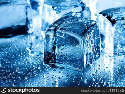 Ice with water droplets over abstract wet background