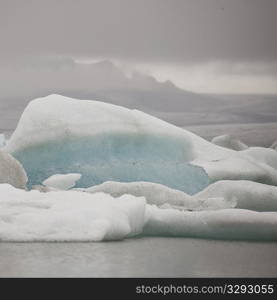 Iceberg floating in glacial lake
