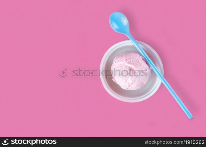 Icecream in bowl putting together with spoons on pink background. Fashion and Food concept.