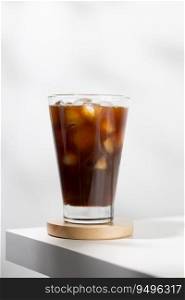 Iced americano in a glass on a white table
