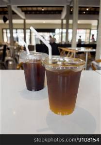 Iced americano with orange and iced americano in coffee shop, stock photo